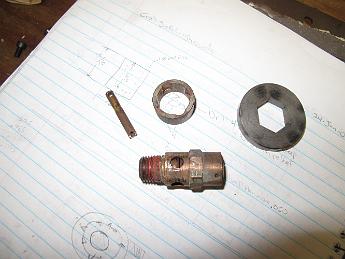 BrokenSafetyValve14May2010 004 Here's the valve with the shroud pushed off. I just happened to have a steel washer with the same size 11/16