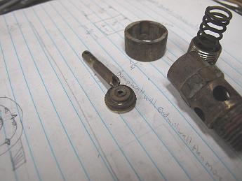 BrokenSafetyValve14May2010 009 Here is the disassembled valve. The stem broke where it meets the valve disk.