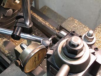 CrabWaterPumpModifications9Sept09 009 Using a dial-test indicator to insure the side of the cutter is parallel to the ways, insuring the groove is cut to the proper depth.
