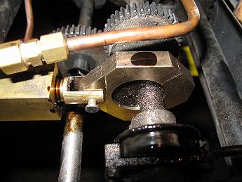 CrabWaterPumpModifications9Sept09 015 The new assembled water pump eccentric strap.  The dark smudge on the top of the strap is steam oil covering the oil hole.  With just a little time on the track this shiny new part will be covered in coal cinders like the rest of the moving parts!