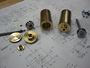 Crab_Parts_Oct_2002 001 September and October 2002 were all about lathe work, brass and stainless steel.  Here are the cylinder assemblies, two each.  The stainless steel work was on the pistons and rods.  The cylinders were bored out to 1.375