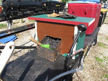 IMG_3201 2015 The new seat / coal bunker. Lift the seat to fill, scoop from the front. I designed it, Dad constructed it, I finished the metal bunker. Could use a coat of paint and some padding for the seat!
